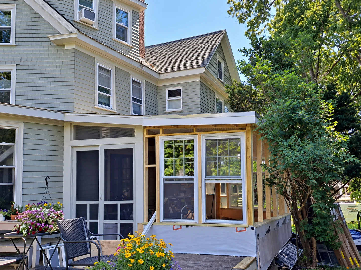 House with an unfinished porch addition in Waltham